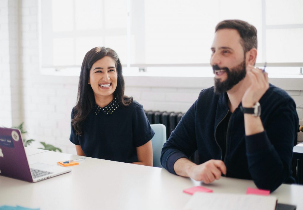 Two people engaged in self confidence and assertiveness training.