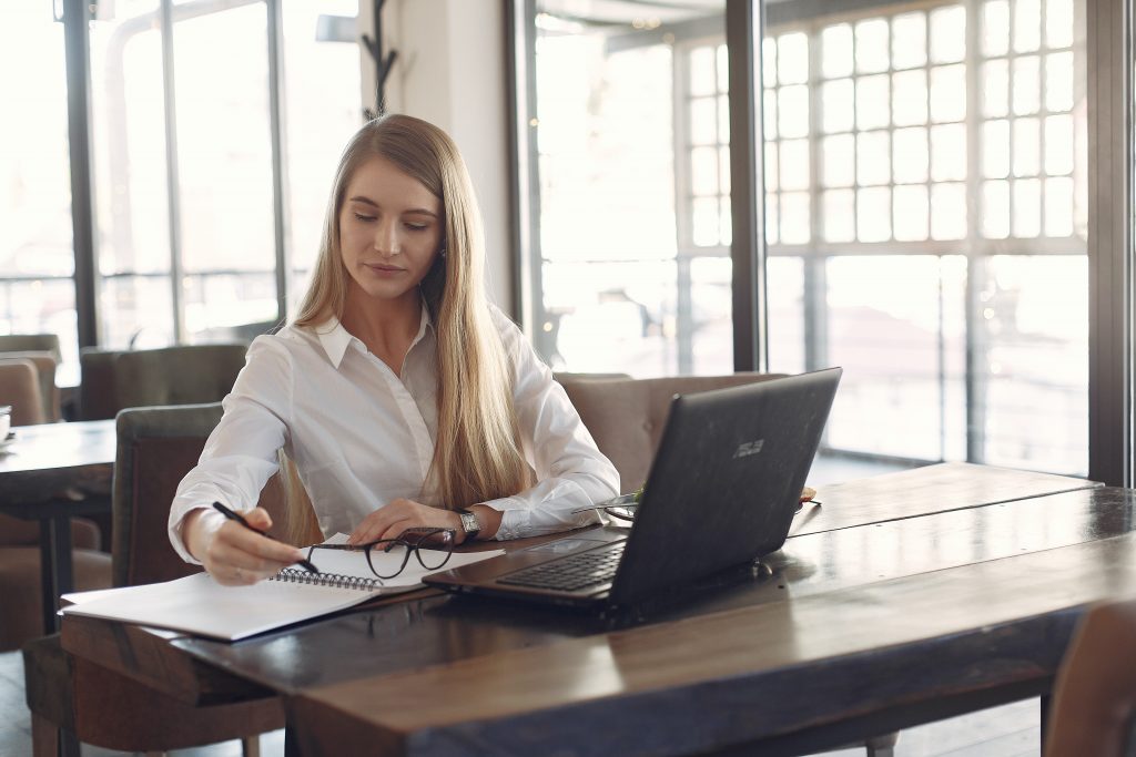 One person seated filling out a job application.