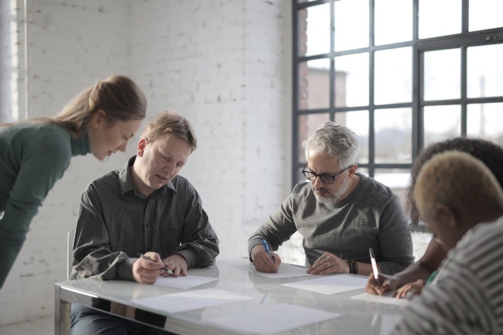 Multiple people working collaboratively on contract management.