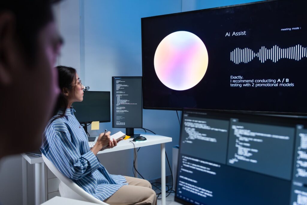 Two team members ate testing AI Assist program.