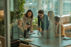 A group of 5 team members in the meeting room.
